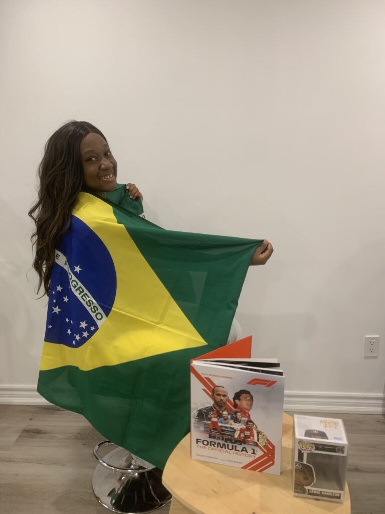 Deidra Clarke posing with F1 paraphernalia