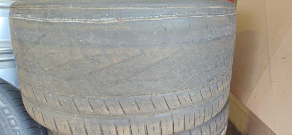 Close up of tires that have been destroyed due to misalignment.