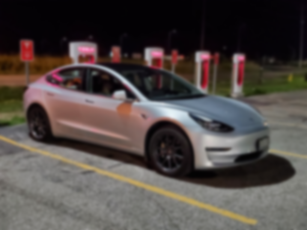 Tesla Model 3 at a Supercharger