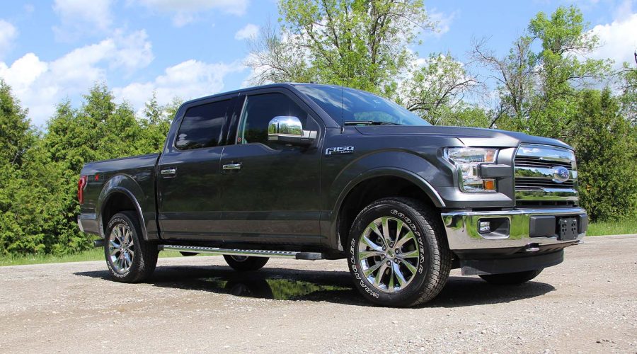 The Ford F-150 Lariat 4x4 SuperCrew is covered in chrome.