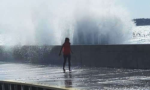 Young person on the pier in Port Elgin Ontario