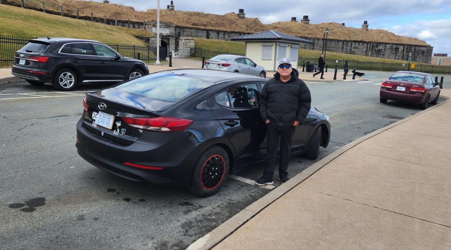 Tim German standing with his Hyundai Elantra at Halifax Citadel National Historic Site