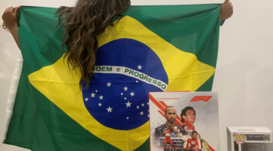 Deidra Clarke posing with F1 Paraphernalia